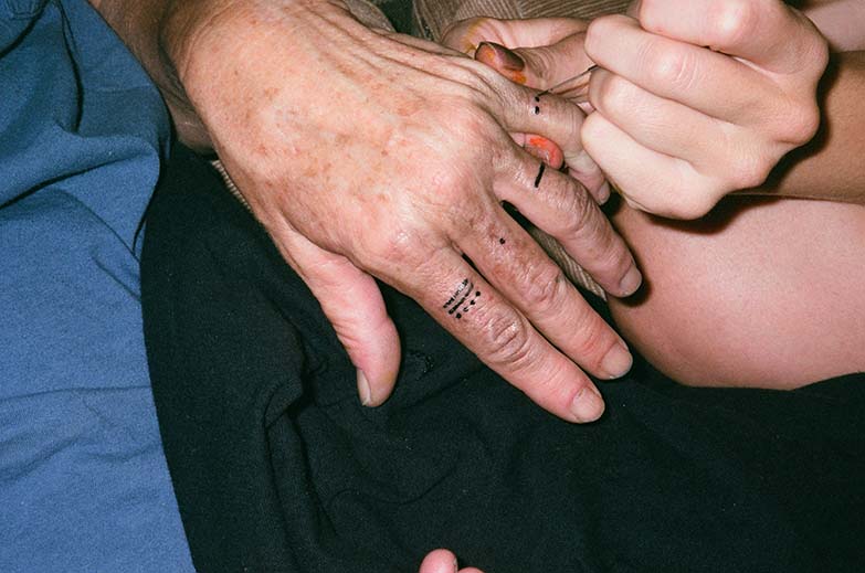 gloria giving her mom a tattoo<br />oakland, ca<br />2023